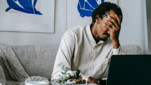 Veteran reviewing VA disability paperwork and medical records while preparing a claim and catching common VA claim mistakes.